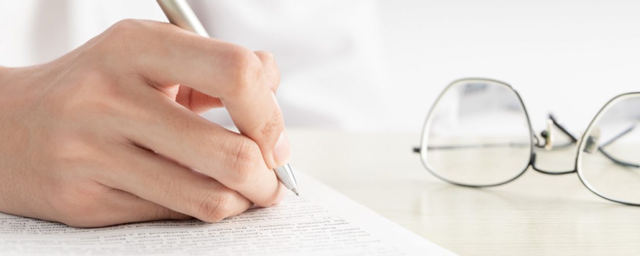 hand-businesswoman-writing-paper-office (1)